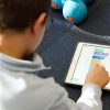 Young boy playing with ipad